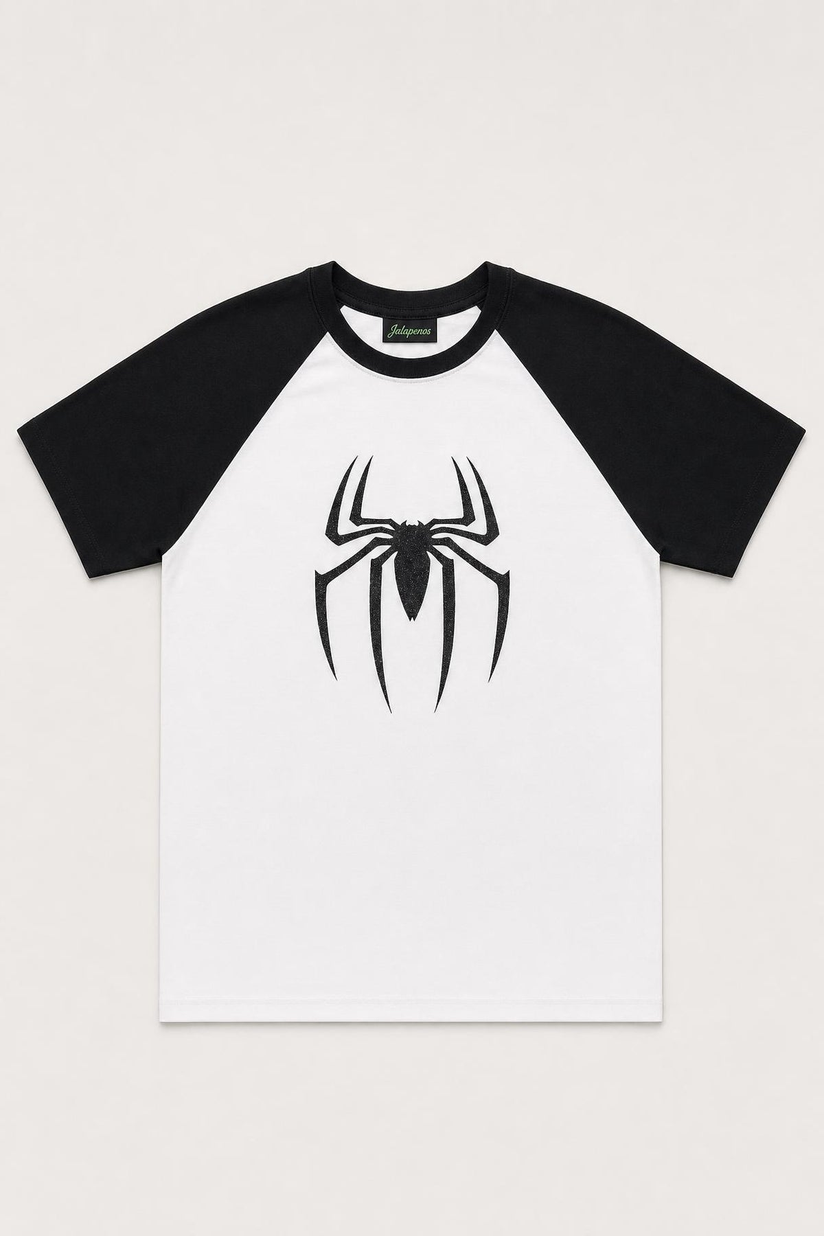Spider glitter raglan tee with black sleeves, flat lay