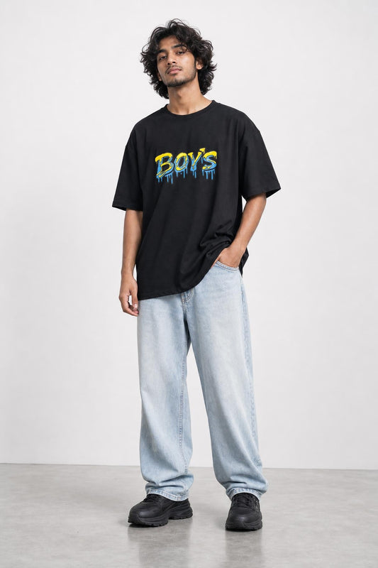 Boys graffiti oversized tee in black, front view on him