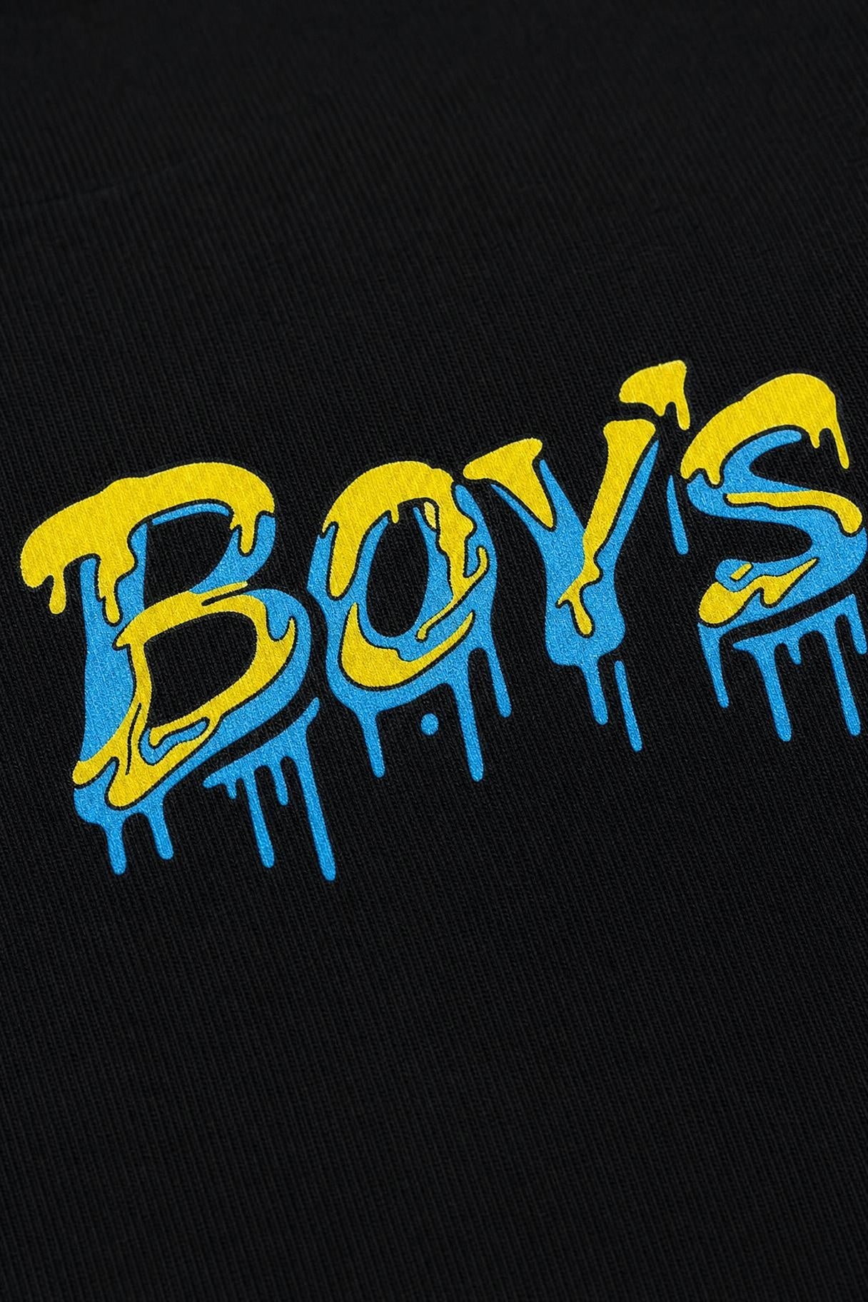 Close view of the dripping graffiti print on black cotton