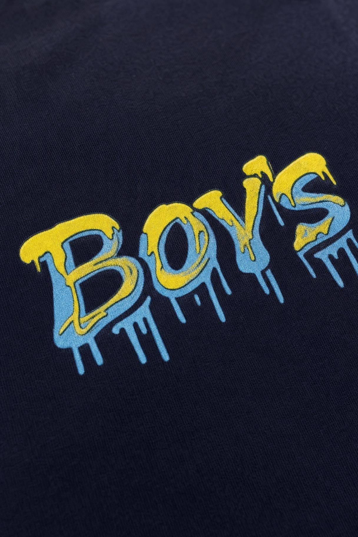 Close view of the dripping graffiti print on navy cotton