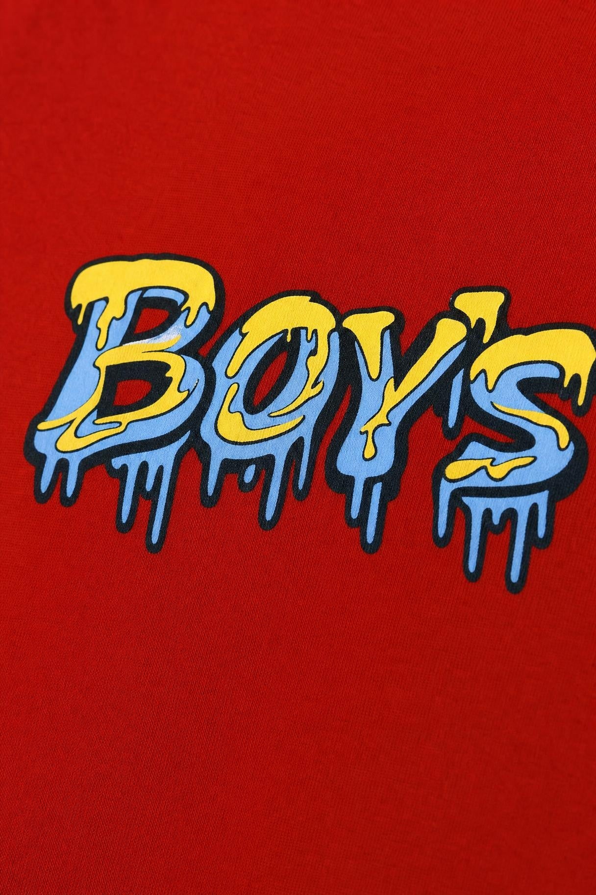 Close view of the dripping graffiti print on red cotton