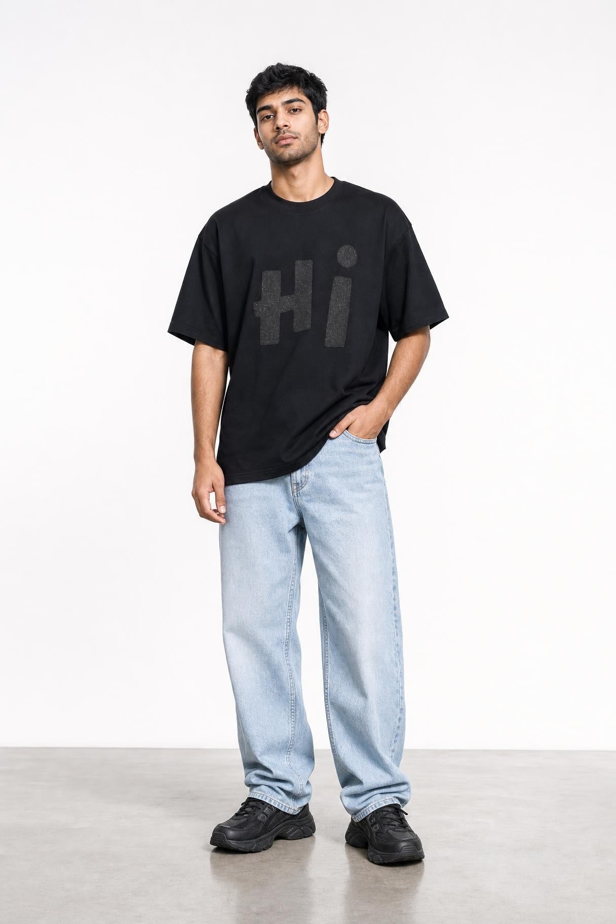 Hi glitter oversized tee in black, front view on him