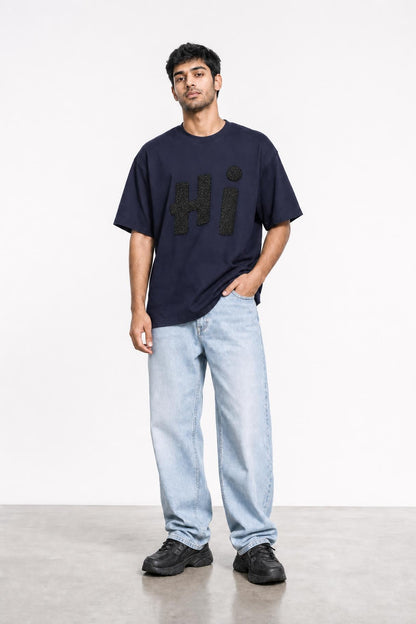 Hi glitter oversized tee in navy, front view on him