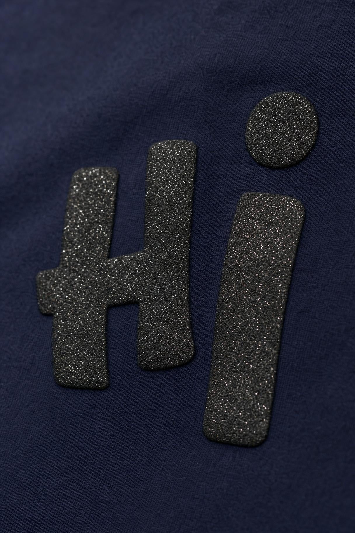 Close view of the Hi glitter print on navy cotton