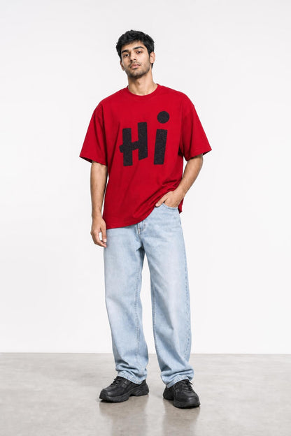 Hi glitter oversized tee in red, front view on him
