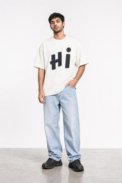Hi glitter oversized tee in white, front view on him