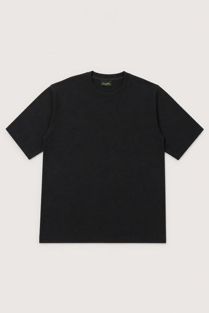 Plain oversized tee in black, flat lay