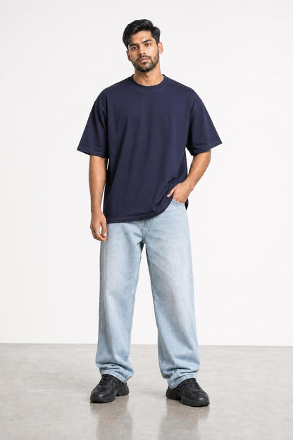 Plain oversized tee in navy, front view on him