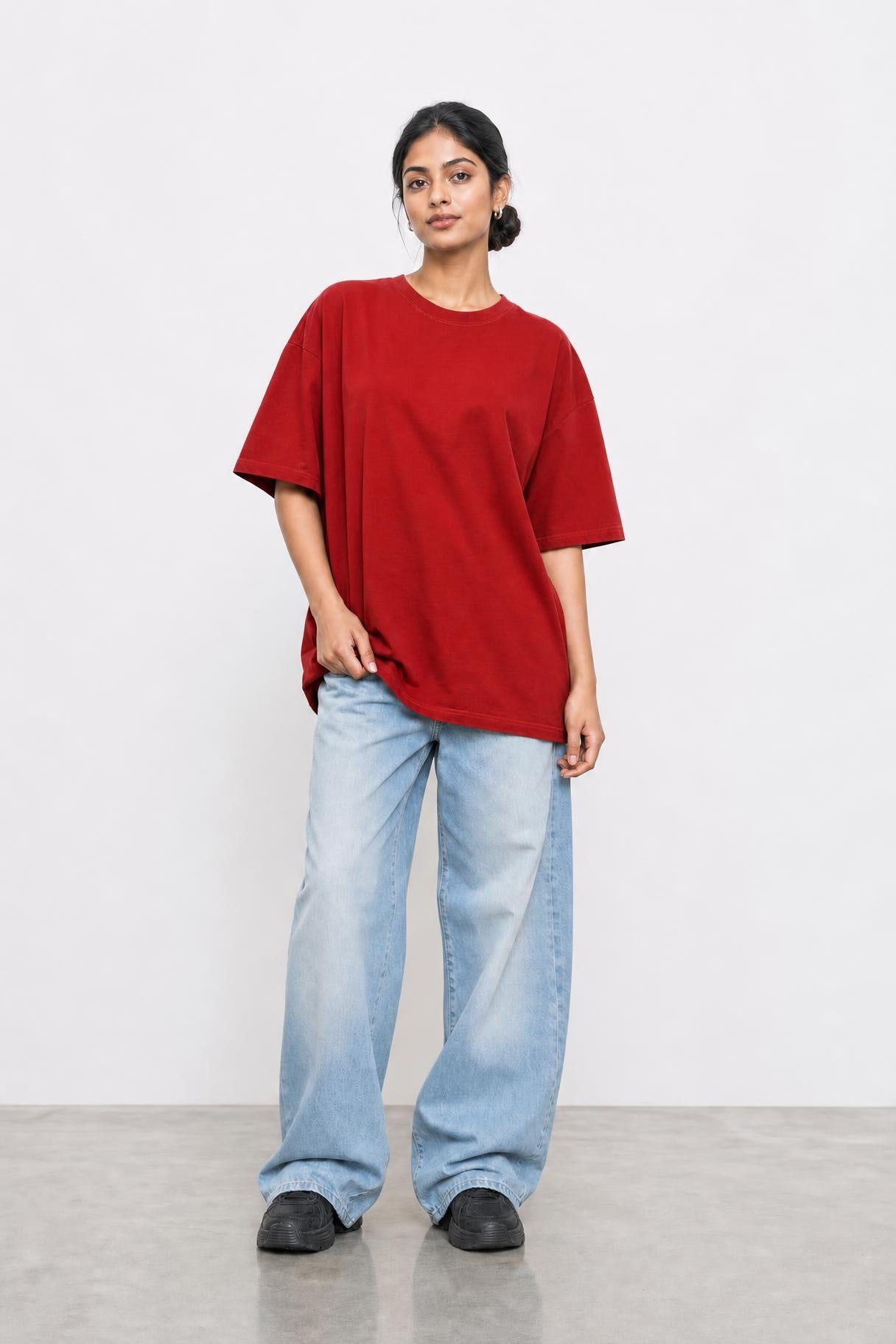 Plain oversized tee in red, front view on her
