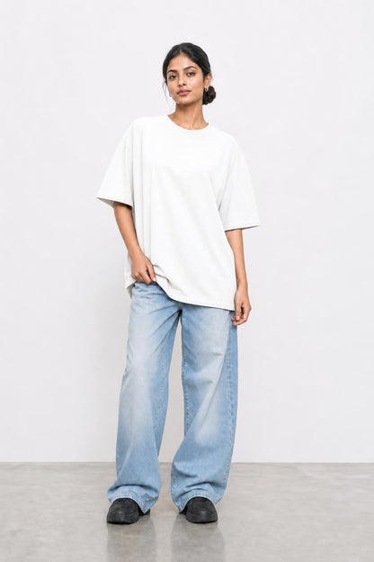 Plain oversized tee in white, front view on her
