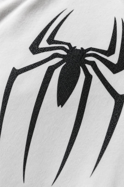 Spider glitter raglan tee with black sleeves, close view of the black glitter print