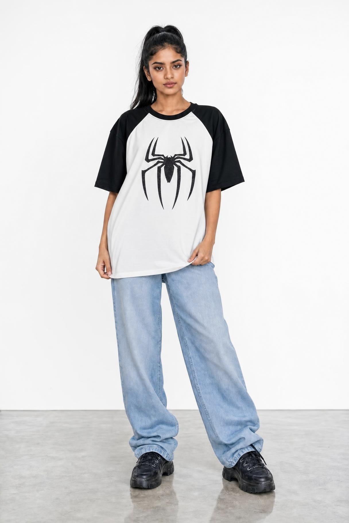 Spider glitter raglan tee with black sleeves, front view on her